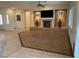 Bright living room with tiled flooring, a cozy fireplace, and easy access to other areas of the home at 1654 Danbury Crossing Dr, Henderson, NV 89052