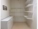 Walk-in pantry featuring built in white wire shelving and a white counter with drawers below at 1654 Danbury Crossing Dr, Henderson, NV 89052