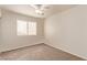 Bedroom with neutral walls, ceiling fan, and a window that brings in plenty of light at 178 Beach Oak Ave, Henderson, NV 89002