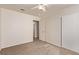 The bedroom has a ceiling fan, neutral walls, and direct access to the hallway at 178 Beach Oak Ave, Henderson, NV 89002
