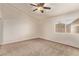 Serene bedroom with neutral carpet and ample natural light through a large window, creating a peaceful retreat at 178 Beach Oak Ave, Henderson, NV 89002