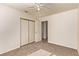 Neutral bedroom with ceiling fan, carpet, and a sliding door closet provides a blank canvas at 178 Beach Oak Ave, Henderson, NV 89002