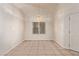 Bright dining area with tile flooring, natural light, and a modern chandelier at 178 Beach Oak Ave, Henderson, NV 89002