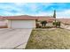 Charming single-story home featuring a two-car garage and well-maintained desert landscaping at 178 Beach Oak Ave, Henderson, NV 89002