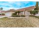 Inviting single-story home featuring desert landscaping, a security door, and a well-maintained yard at 178 Beach Oak Ave, Henderson, NV 89002