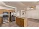 Open kitchen layout with a center island, stainless steel appliances, and ample cabinet space, designed for efficiency and style at 178 Beach Oak Ave, Henderson, NV 89002
