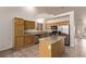 Well-equipped kitchen featuring granite countertops, stainless steel appliances, and a convenient center island, ideal for cooking at 178 Beach Oak Ave, Henderson, NV 89002