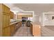 Stylish kitchen with stainless steel appliances, granite countertops, and an island that enhances the modern design of the space at 178 Beach Oak Ave, Henderson, NV 89002