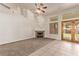 Spacious living room with a cozy fireplace and natural light streaming through the glass doors, perfect for relaxing at 178 Beach Oak Ave, Henderson, NV 89002