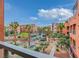 Balcony overlooks landscaped common area in complex at 19 E Agate Ave # 402, Las Vegas, NV 89123