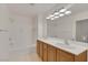 Bathroom featuring a shower, soaking tub, and double sink vanity at 19 E Agate Ave # 402, Las Vegas, NV 89123