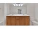 Bathroom featuring a double sink vanity and well-lit mirror at 19 E Agate Ave # 402, Las Vegas, NV 89123