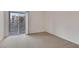 Bright bedroom with sliding glass door to a balcony at 19 E Agate Ave # 402, Las Vegas, NV 89123