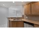 Open kitchen with granite countertops and stainless steel appliances provides great space at 19 E Agate Ave # 402, Las Vegas, NV 89123
