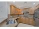 Well-equipped kitchen featuring stainless steel appliances, gas cooktop, and spacious countertops at 19 E Agate Ave # 402, Las Vegas, NV 89123