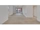 Open-plan living room with access to a patio and neutral carpet at 19 E Agate Ave # 402, Las Vegas, NV 89123