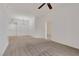 Bright and airy living room featuring a modern chandelier and plush neutral carpet at 19 E Agate Ave # 402, Las Vegas, NV 89123