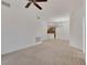 Cozy living area with neutral carpet, a modern chandelier, and bright natural light at 19 E Agate Ave # 402, Las Vegas, NV 89123
