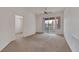 Inviting living room is awash with natural light and features neutral carpeting at 19 E Agate Ave # 402, Las Vegas, NV 89123