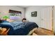 Bright bedroom with natural light features a bed with decor, a window and neutral walls at 2012 Lady Lake St, Las Vegas, NV 89128