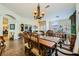 Dining room with natural light, ornate table and chairs, and open access to other living areas at 2012 Lady Lake St, Las Vegas, NV 89128