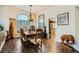 Formal dining room with tile floors, natural light, and ornate table and chairs at 2012 Lady Lake St, Las Vegas, NV 89128