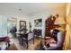 Well-decorated dining room with a round table, patterned chairs, and mirrored closet doors at 2012 Lady Lake St, Las Vegas, NV 89128