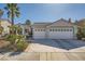 Lovely single-story home featuring a spacious three-car garage and a well-maintained front yard at 2012 Lady Lake St, Las Vegas, NV 89128