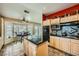 Kitchen with stone floors, granite counters, and access to a breakfast nook area at 2012 Lady Lake St, Las Vegas, NV 89128