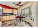 Cozy kitchen nook with a table set by a large window, cabinetry, and unique tile flooring at 2012 Lady Lake St, Las Vegas, NV 89128