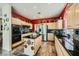Kitchen with island, stainless steel appliances, and an open doorway to the dining room at 2012 Lady Lake St, Las Vegas, NV 89128
