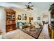 Spacious living room with stylish decor, comfortable seating, and an elegant display cabinet at 2012 Lady Lake St, Las Vegas, NV 89128