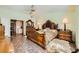 Spacious main bedroom suite with a detailed bed frame, dresser, and convenient access to bathroom at 2012 Lady Lake St, Las Vegas, NV 89128