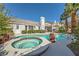 Inviting backyard with a sparkling pool and jacuzzi, perfect for relaxation and entertainment at 2012 Lady Lake St, Las Vegas, NV 89128