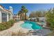 Inviting backyard pool with spa and mature landscaping offers a private outdoor oasis at 2012 Lady Lake St, Las Vegas, NV 89128