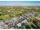 An aerial view of a residential community with mature trees, a golf course, and mountain views on the horizon at 2058 Ottawa Dr, Las Vegas, NV 89169
