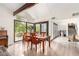 Bright dining room featuring hardwood floors and ample natural light with large windows at 2058 Ottawa Dr, Las Vegas, NV 89169