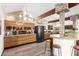 Modern kitchen features stone accents, unique lighting, and stainless steel appliances at 2058 Ottawa Dr, Las Vegas, NV 89169