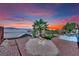 A beautiful backyard with desert landscaping and views of the mountains at 2077 Wildwood Lake St, Henderson, NV 89052