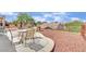 Spacious backyard featuring desert landscaping and an outdoor seating area perfect for entertaining at 2077 Wildwood Lake St, Henderson, NV 89052