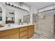 Bathroom featuring a double sink vanity, and glass enclosed shower with bench at 2077 Wildwood Lake St, Henderson, NV 89052