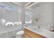 Bright bathroom featuring a single sink vanity, a large mirror, and a shower-tub combination at 2077 Wildwood Lake St, Henderson, NV 89052