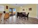 Cozy dining area featuring wood floors and sliding glass doors to the backyard at 2077 Wildwood Lake St, Henderson, NV 89052