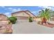 Single-story home with a spacious driveway and well-maintained landscaping at 2077 Wildwood Lake St, Henderson, NV 89052
