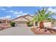 Charming single-story home with a two-car garage and desert landscaping at 2077 Wildwood Lake St, Henderson, NV 89052