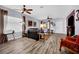 Spacious living room showcasing wood floors and a leather sofa set at 2077 Wildwood Lake St, Henderson, NV 89052