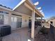 Relaxing back patio with covered seating area, ideal for outdoor dining at 2270 Canyon Song Ave, Laughlin, NV 89029