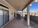 Relaxing back patio with covered seating area, ideal for outdoor dining at 2270 Canyon Song Ave, Laughlin, NV 89029