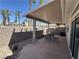 Back patio with covered seating area and serene outdoor landscape views at 2270 Canyon Song Ave, Laughlin, NV 89029