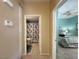 Hallway view into a bathroom and bedroom, tiled floor and shower/tub at 2270 Canyon Song Ave, Laughlin, NV 89029